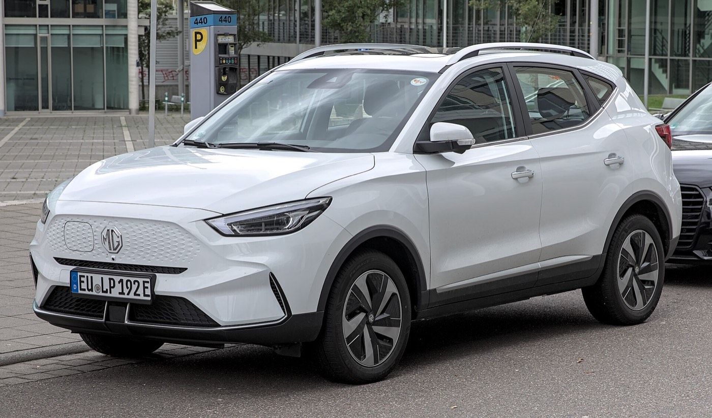 MG ZS EV parked beside a public charging point