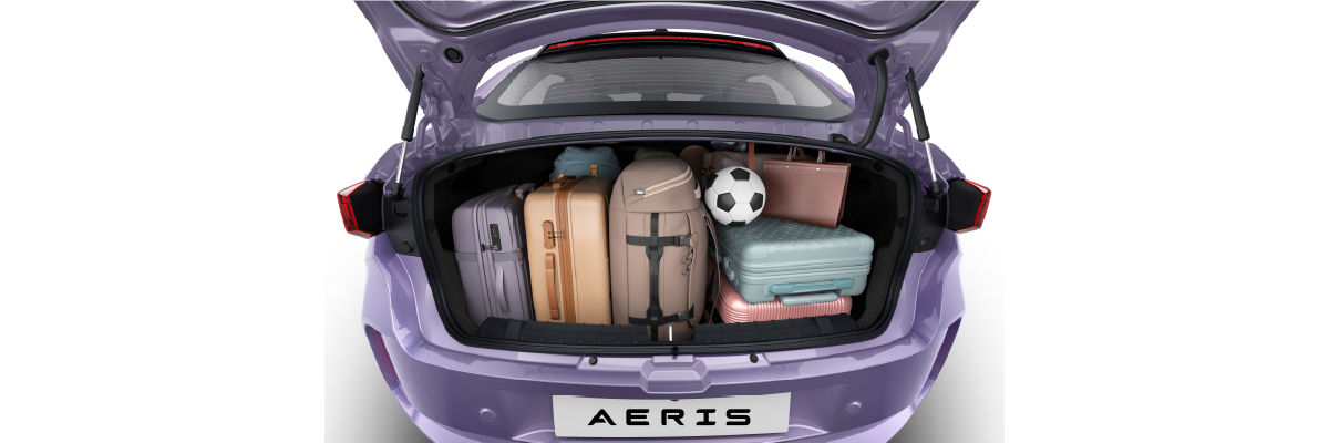The Aeris with its bootlid open and cases, a bag and a ball loaded inside